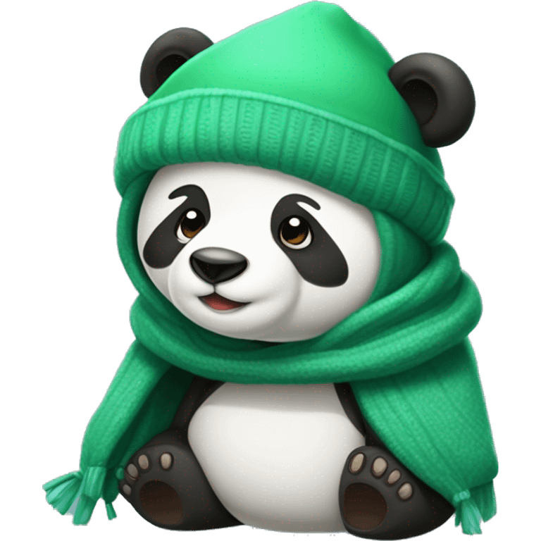 Un osos panda tapado con una manta verde y con gorro de invierno emoji