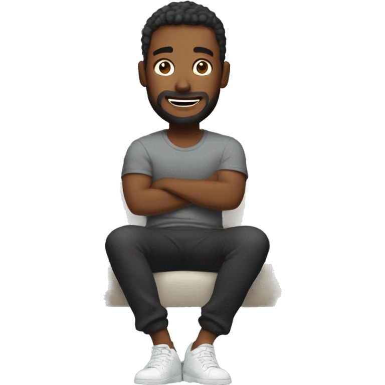 Man in grey joggers and black t shirt sat on sofa emoji