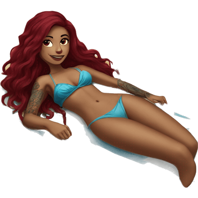 Beautiful tattooed burgundy long haired woman laying on the beach emoji