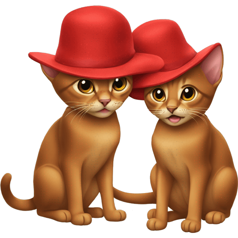 Two Abyssinian cats in big red hats playing with each other emoji