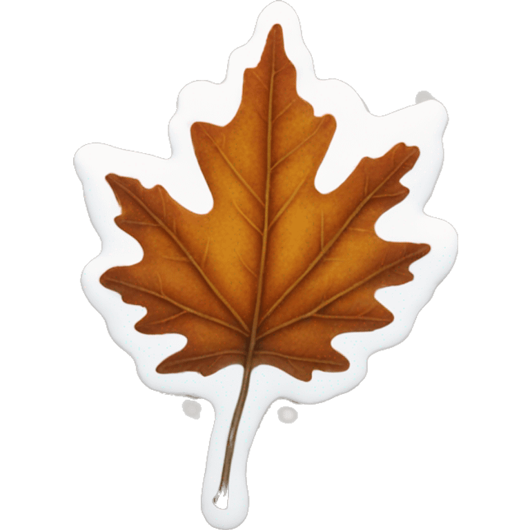 An autumn leaf with snow on it emoji