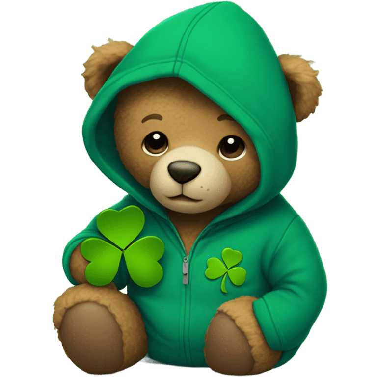 
A teddy bear wears a blue hoodie and holds a shamrock emoji