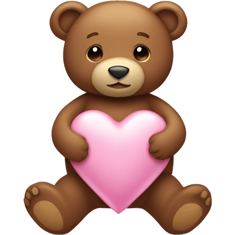 Brown teddy bear holding a light pink heart emoji