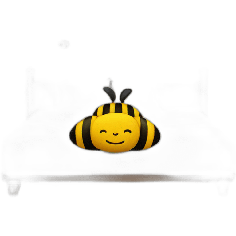 A bed with a giant bee on with a smiley face pillow emoji