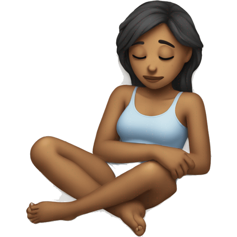 A girl laying down holding her stomach with a sad face emoji