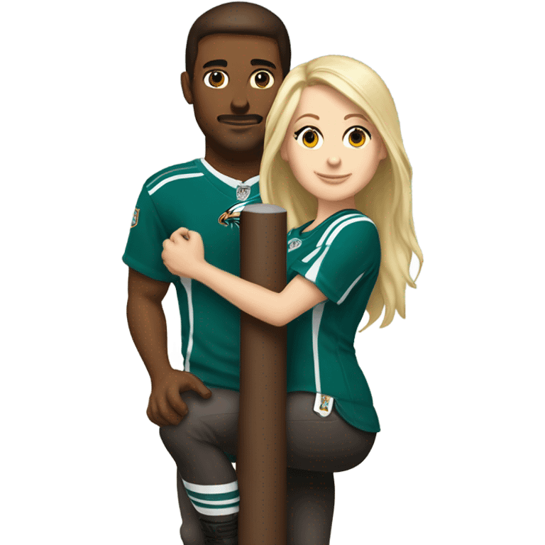 Brunette white female with brown eyes and blonde white male who are both eagles fan climbing up a pole emoji