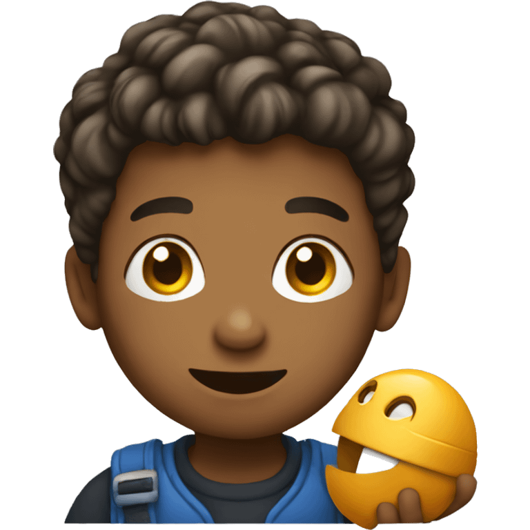 A boy holding a toy emoji