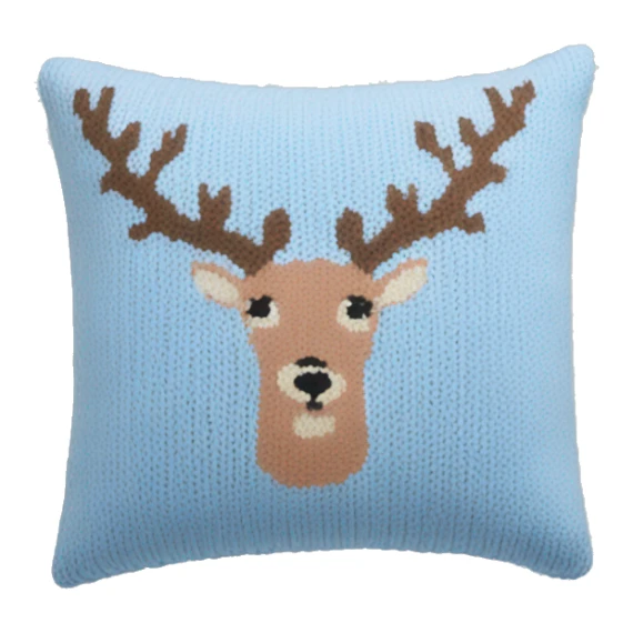 pastel blue knitted pillow with deer print sticker