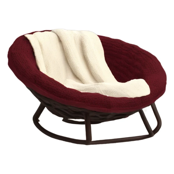 Cozy cream papasan chair with maroon pillow and chunky knit blanket sticker