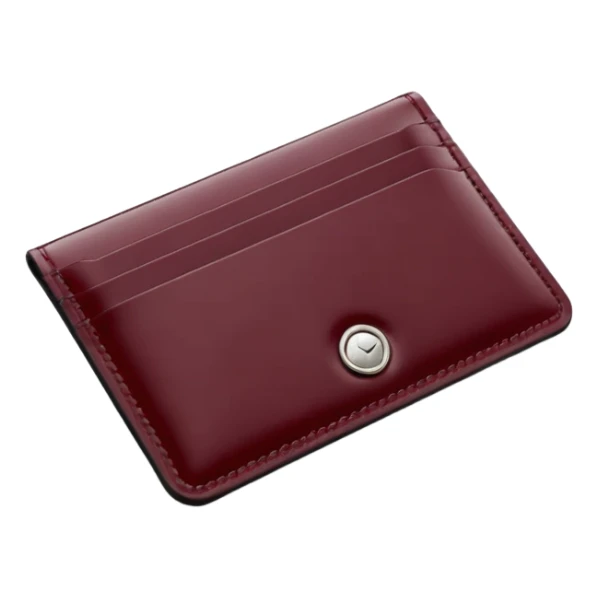 A professional studio photograph of a high-quality, slim leather card holder. The card holder is in [deep Burgundy color with a high-gloss patent enamel finish, reflecting light like a jewel .It features precise stitching and minimalist, elegant metal hardware sticker