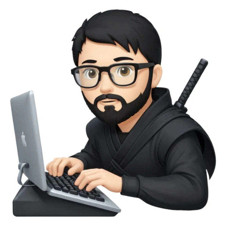 Man with black hair and beard wearing glasses in a ninja costume typing on a computer keyboard sticker