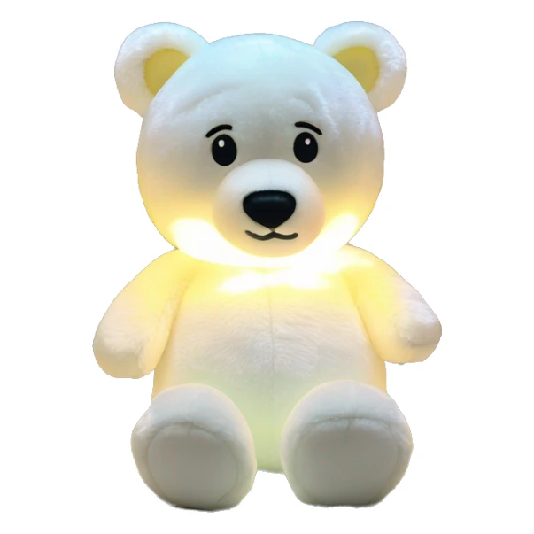 a moonie bear night light plush with its illuminated belly sticker