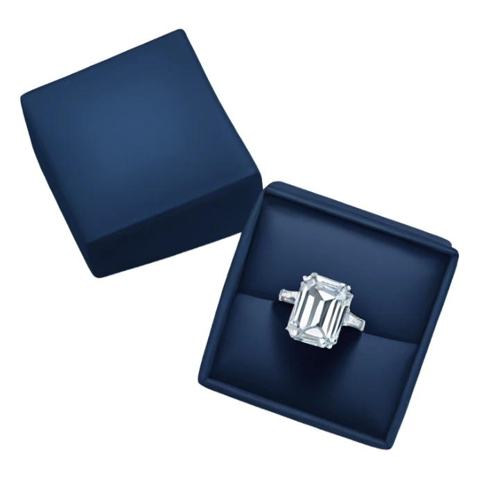 An emerald cut ring with a big diamond in a graff navy blue box sticker