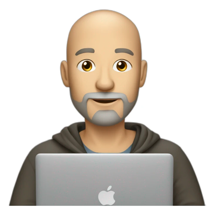 A 44-year old white male developer with shaved head and gray beard sitting with macbook sticker