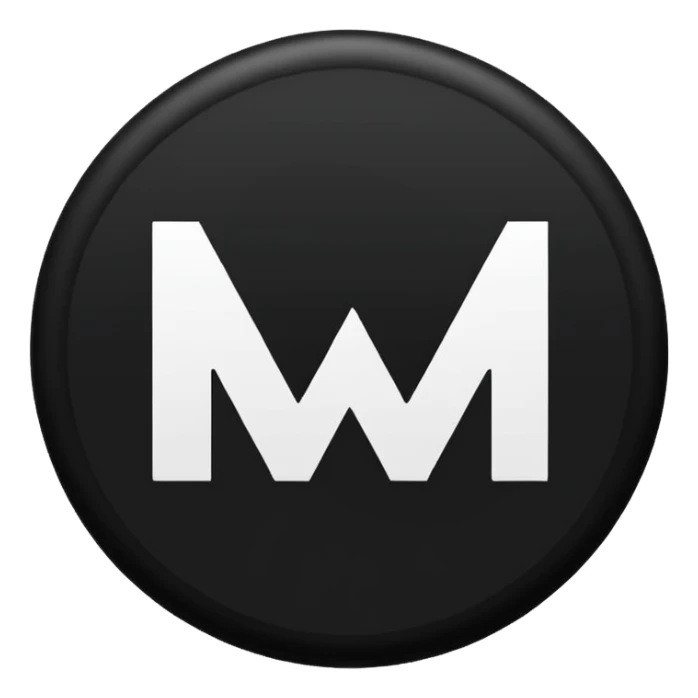 Black circle with “MB” written on in the middle of it. Nothing else no holes or anything. sticker