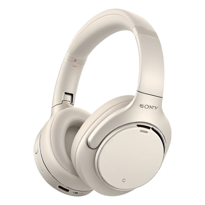 White Sony WH-1000XM4 headphones with minimal design, over-ear style with subtle Sony branding sticker