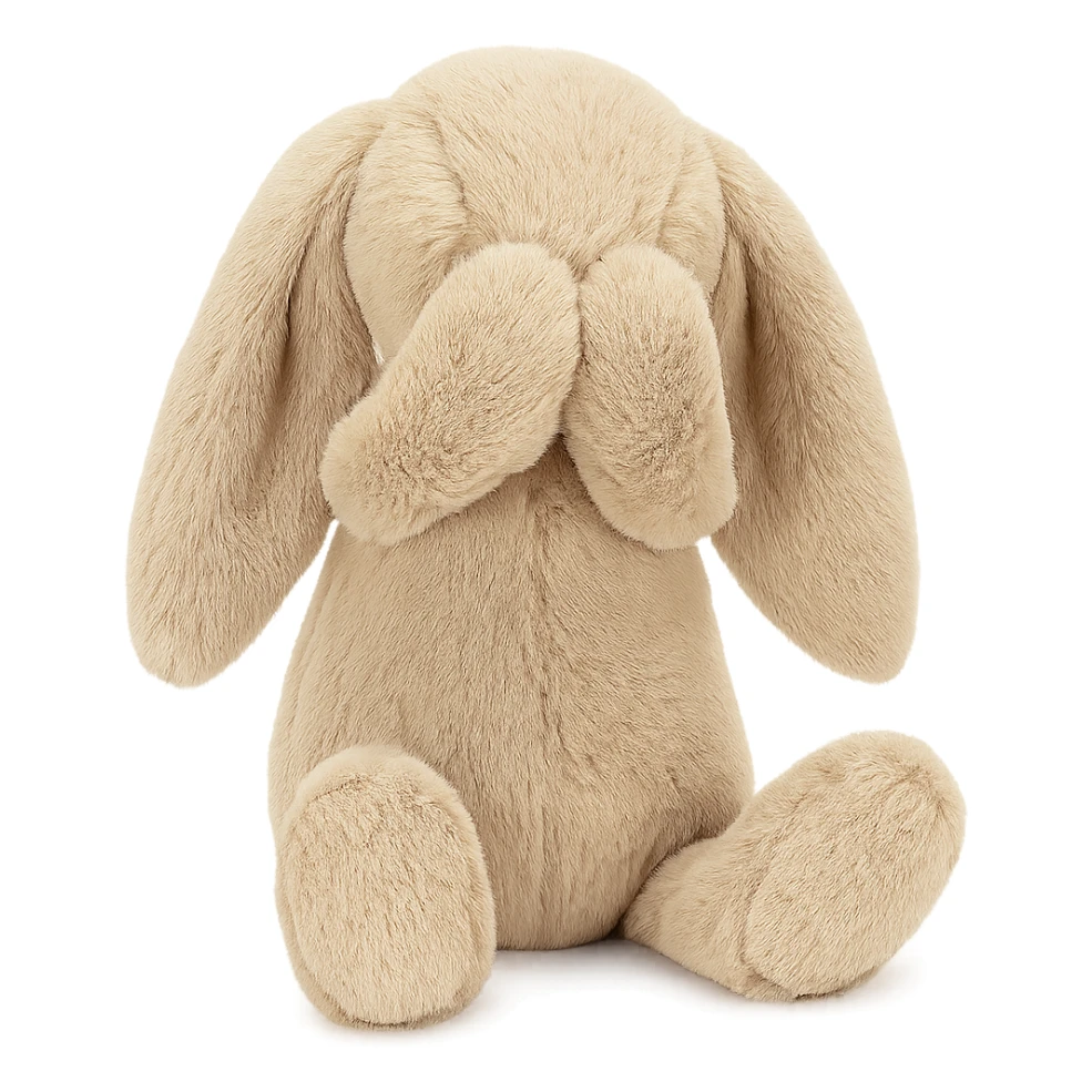beige Jellycat Bashful Bunny plush, sitting with paws covering face, floppy ears sticker