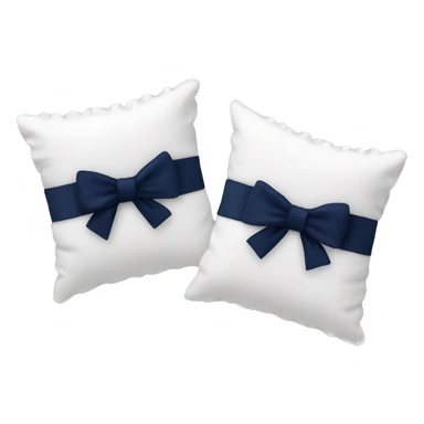 2 white pillows with ruffles and a navy blue bow sticker