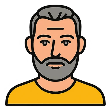 A middle-aged man with a medium slightly gray beard, short hair cut to the scalp on the sides and combed back on top, blue eyes sticker