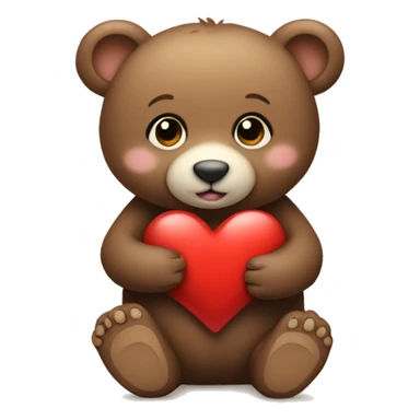 A baby bear sitting holding a heart sticker