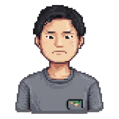 Asian man in a gray shirt with a frown sticker