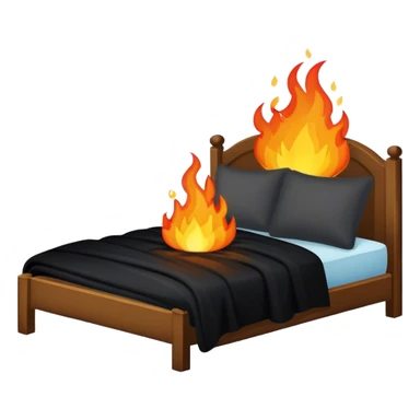 a bed with a black blanket on fire sticker