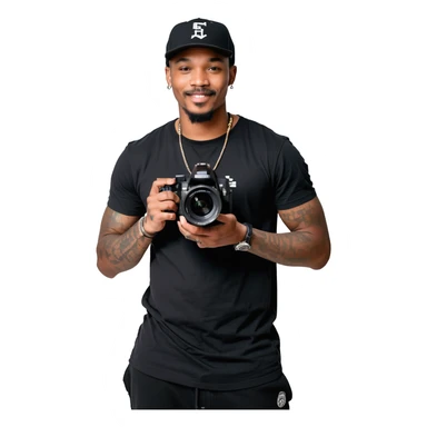 A young, black, South African, male cinematographer dressed in a black round neck t-shirt, black pants and black baseball cap holding a mirrorless dslr camera in one hand. Dark brown eyes. Bright white smile. Minimal facial hair — a small moustache connected to a goatee. Arms covered in tattoos. sticker