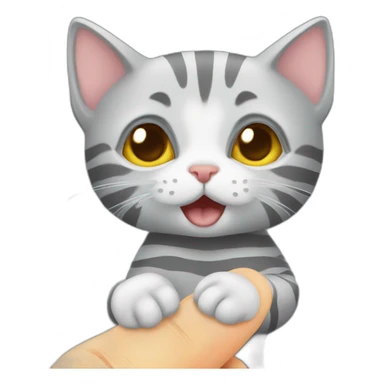Gray striped kitten chewing on a finger sticker