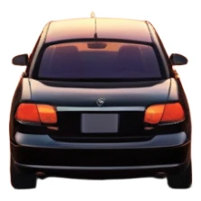 A parked car sits quietly on the side of an open road, facing a breathtaking sunset. Two people stand outside, backs turned, watching the horizon. The road stretches endlessly ahead, surrounded by a peaceful, glowing landscape full of light, warmth, and possibilit sticker