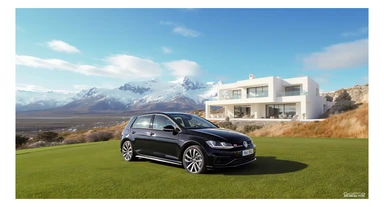 black Golf 4 with, in background is modern huge two flors white villa, in distance are iceland mountains, rule of thirds, shot on gopro hero, noise camera sticker