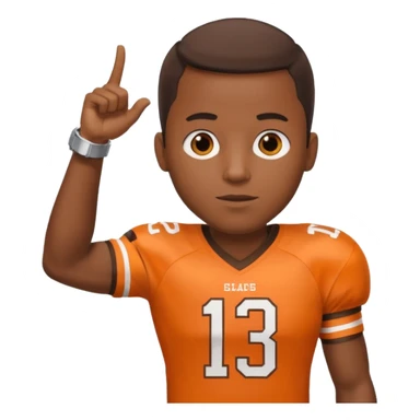 Black man in a brown and orange football jersey holding up his left arm with a watch on, pointing at the watch with his right hand sticker