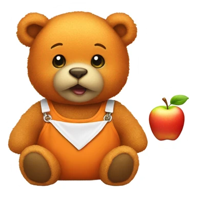 Small orange teddy bear wearing a bib with an apple on  sticker