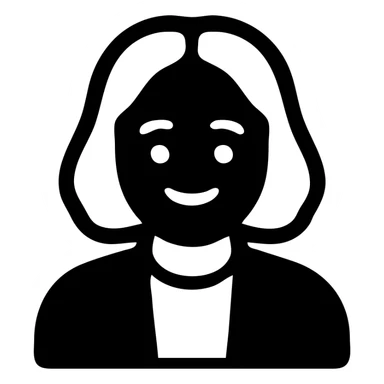 Man with white hair parted in the middle, black in color, shoulder-length, smiling, wearing a white shirt and a black jacket sticker