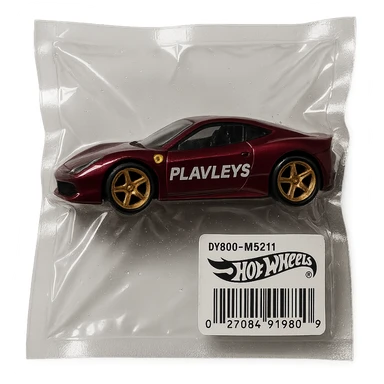 burgundy Ferrari Hot Wheels car with 'PLAVLEYS' text on the side, glossy, vacuum-sealed style sticker