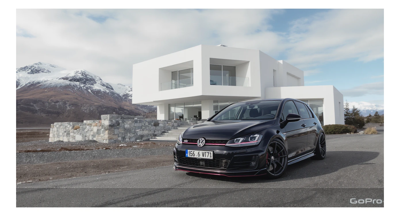black Golf A4 with bodykit, in background is modern huge two flors white villa, in distance are iceland mountains, rule of thirds, shot on gopro hero, noise camera sticker