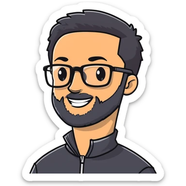 Light-skinned man with short black hair styled upwards, full short graying beard, smiling, wearing large black-framed glasses and a black long-sleeve sports shirt with zip at the neck sticker