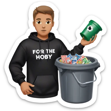 Man with black sweatshirt that says FOR THE HOBBY in white lettering throwing a trash cand filled with wrappers from football trading cards sticker