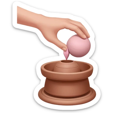 one hand pressing down on a pink ball of clay above an empty pottery wheel, with the clay not touching the wheel surface, hovering slightly above it sticker