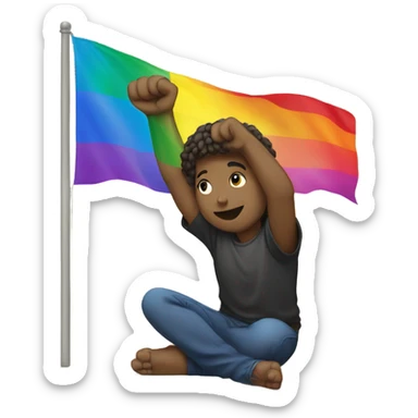 Person holding fist up kneeling on ground rainbow flag behind sticker