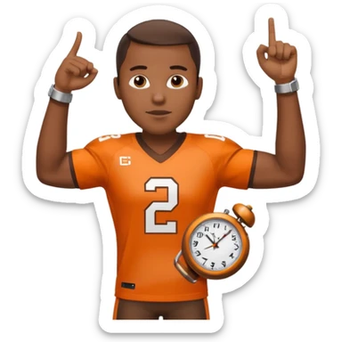 Black man in a brown and orange football jersey holding up his left arm with a watch on, pointing at the watch with his right hand sticker