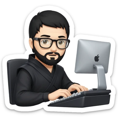 Man with black hair and beard wearing glasses in a ninja costume typing on a computer keyboard sticker