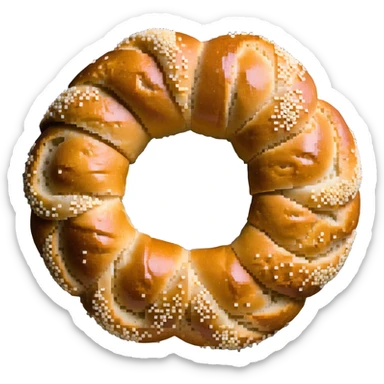 A traditional Turkish circular sesame bread, resembling a ring with a hole in the middle, covered in sesame seeds. It has a golden brown color. sticker