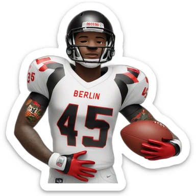 male black football player with tattoo on left arm. White jersey with number 45 and lettering Berlin above the number. white longsleeve on right arm and two red gloves sticker