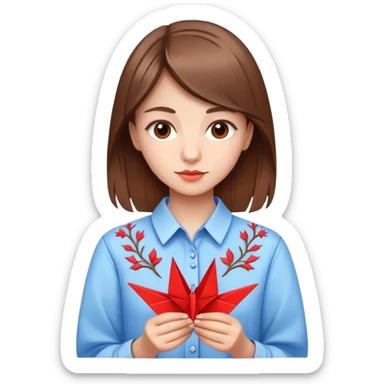 Ukrainian young girl with brown hair wearing an embroidered shirt holds an origami red crane sticker