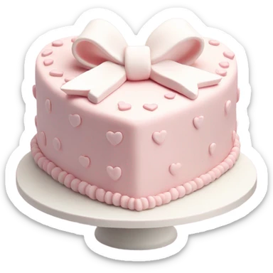 Pastel pink heart shaped cake with fancy white icing and bows sticker