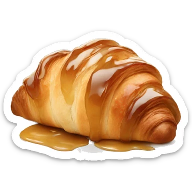 Almond croissant with a caramel syrup on it sticker