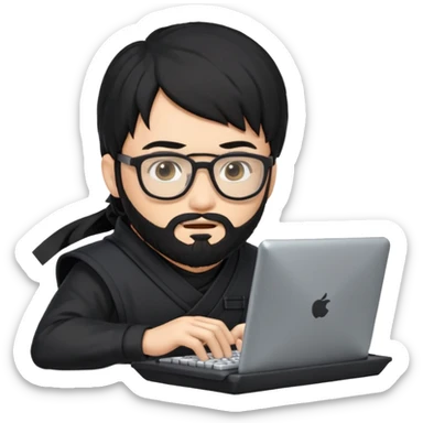 Man with black hair and beard wearing glasses in a ninja costume typing on a computer keyboard sticker