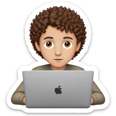 male with brown eyes and very short brown curly hair with a fade, focused on a laptop sticker
