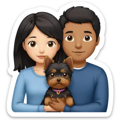 A couple holding holding a small Yorkshire Terrier together. The girl is an Asian girl with long, luscious wavy black hair (loose, no hair tie). She is standing beside a brown-skinned man with a short middle part haircut.  sticker