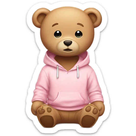 A cute beige teddy bear wearing a light pink hoodie. He is sitting on his butt.  sticker